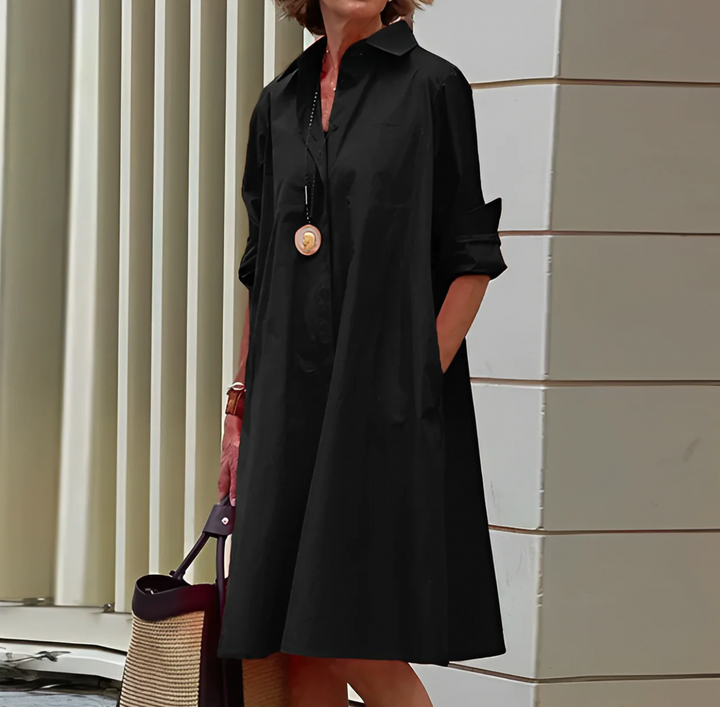 "Robe midi d'été élégante, silhouette flatteuse, tissu léger et aéré, idéale pour journées chaudes et occasions spéciales."