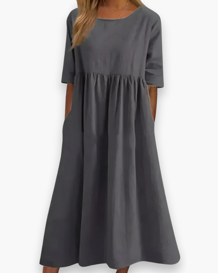 Robe midi élégante femme, blanche, style décontracté avec poches et tissu léger, parfaite toutes occasions.