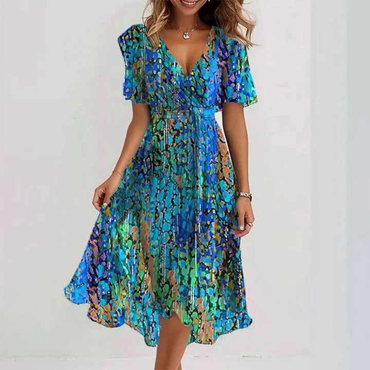 Robe midi femme été, col V, fluide, imprimé floral.  Tissu chiffon léger, coupe cintrée.