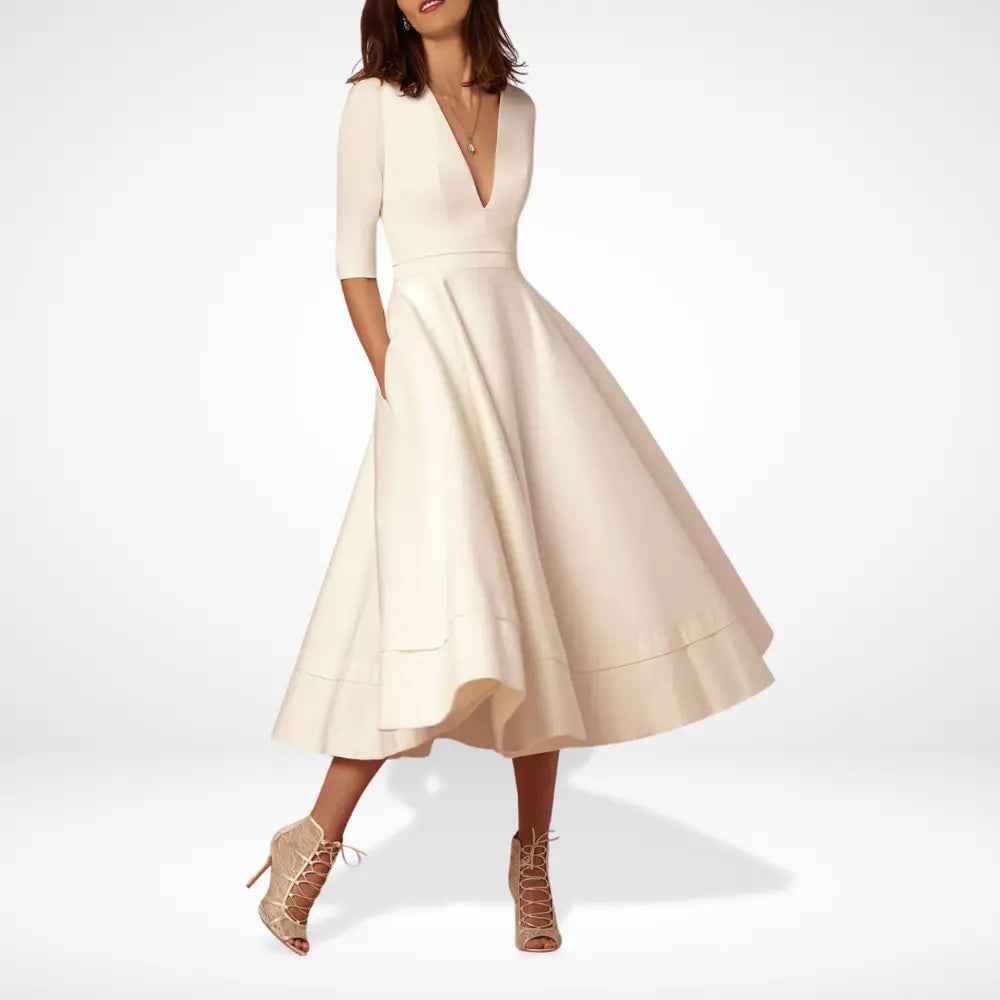 Robe de cocktail midi fluide à manches 3/4 pour femme. Chic et confortable, idéale printemps/été/automne.