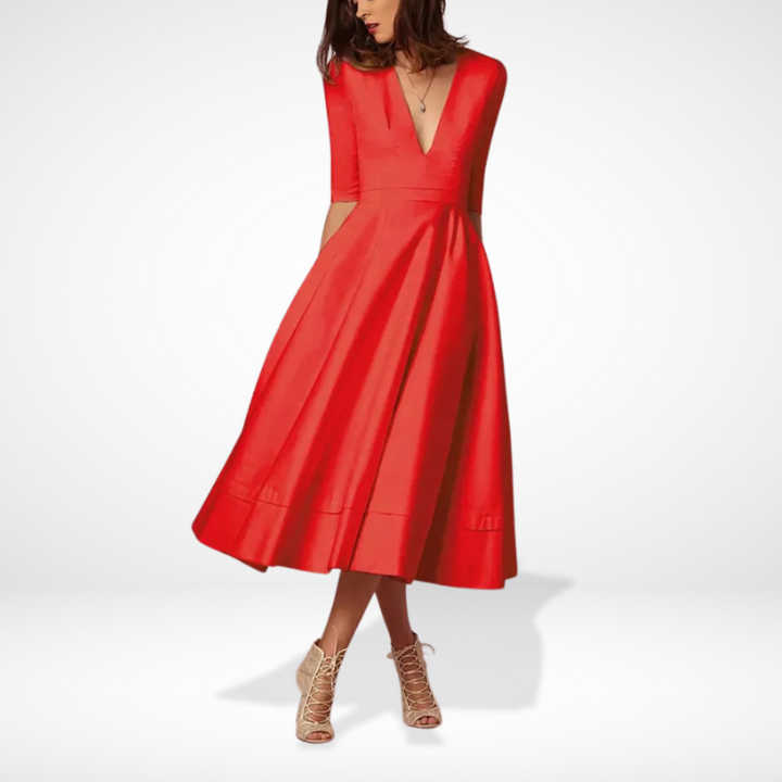 Robe de soirée midi femme chic et fluide à décolleté. Idéale pour mariage, fête ou cocktail élégant.