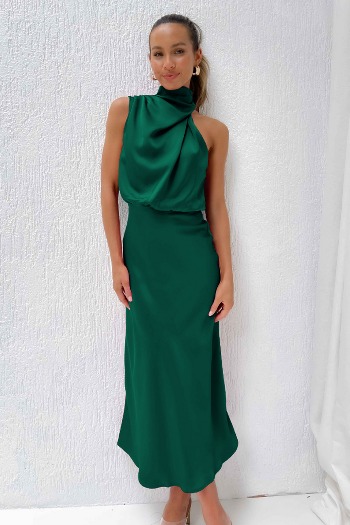 Robe midi chic femme, coupe moderne et asymétrique. Idéale pour événements élégants, cocktail, printemps/été.