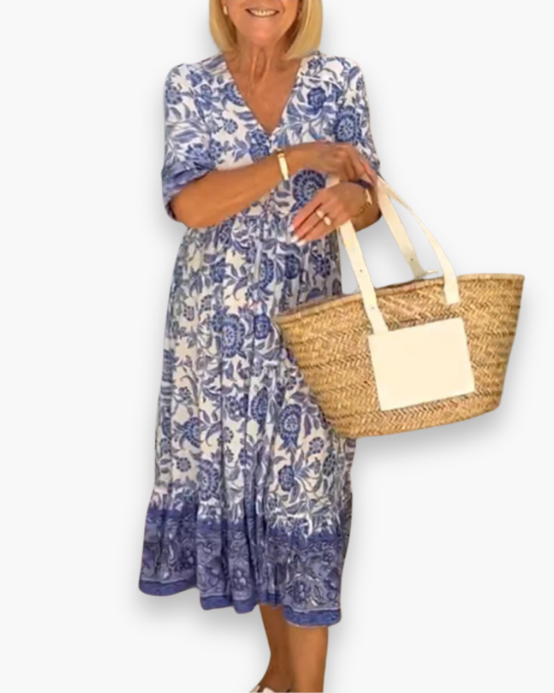 "Robe midi fleurie élégante femme, col en V, motif floral, coupe fluide, style estival, idéale pour journées ensoleillées."