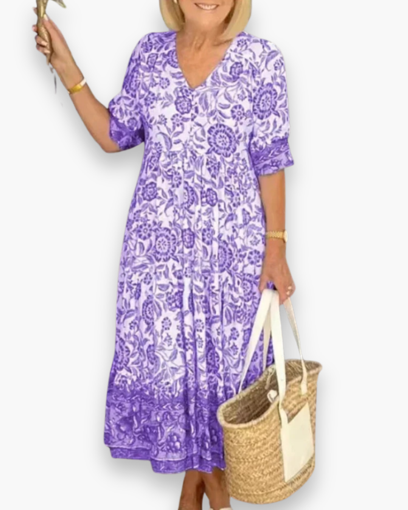 "Robe midi fleurie élégante femme, col en V, motif floral, coupe fluide, style estival, idéale pour journées ensoleillées."