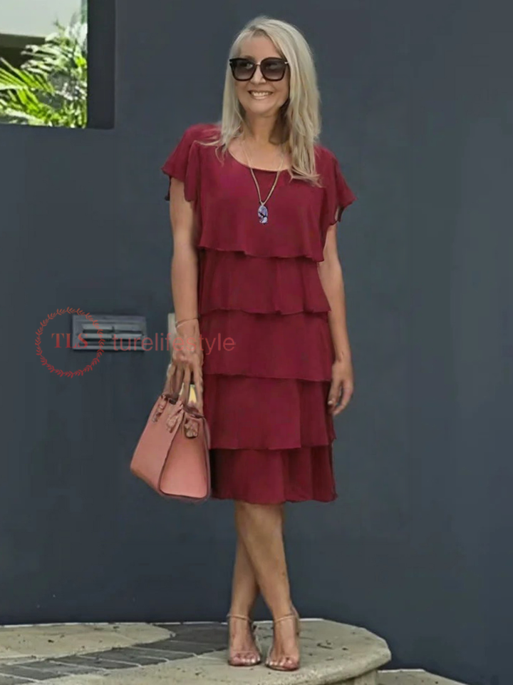 Robe midi femme festive et fluide, asymétrique, superposée, idéale pour l'été et les événements chics.