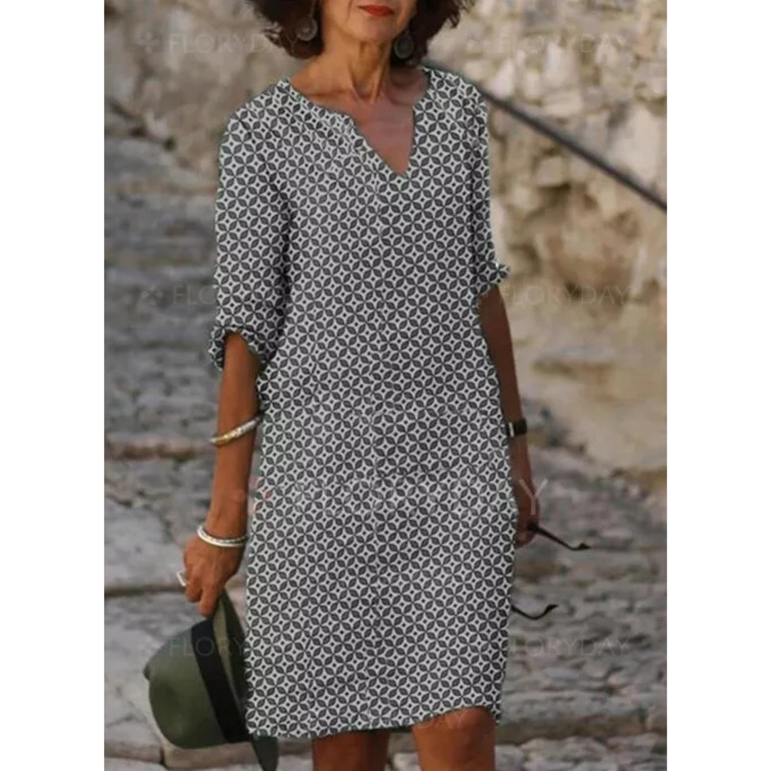 "Robe midi fluide pour femmes, tissu léger et ample, idéale pour l'été et toutes occasions, élégance et confort garantis."
