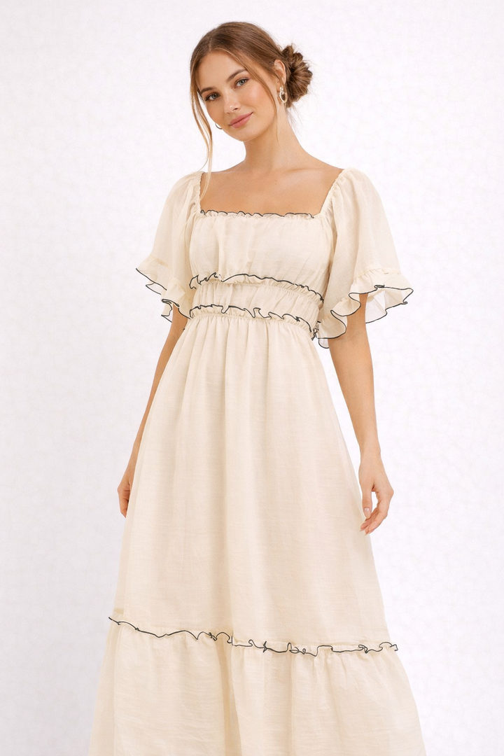 Robe midi élégante beige pour femme, style romantique et fluide, parfaite pour le printemps-été.