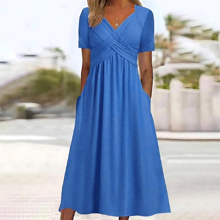 Robe midi élégante pour femme, silhouette flatteuse. Parfaite pour soirées ou tenue chic de bureau.