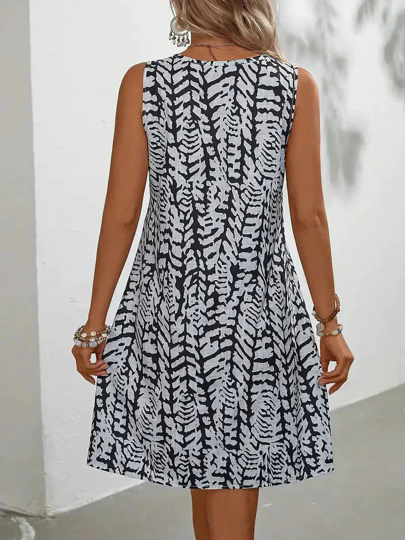 Robe mini sans manches pour femme, imprimé estival, confortable et légère, pour la saison chaude.