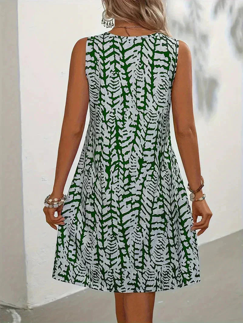Robe d'été mini imprimée femme, sans manches, polyvalente pour casual chic, plage ou ville.
