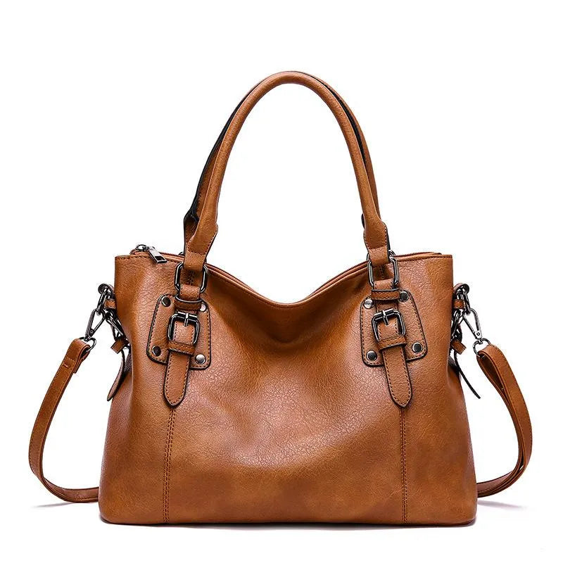 Sac à bandoulière en cuir azure, chic et résistant, avec sangle ajustable et fermeture magnétique, parfait pour femme.