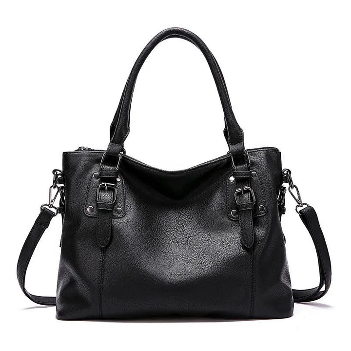 Sac à bandoulière en cuir azure, chic et résistant, avec sangle ajustable et fermeture magnétique, parfait pour femme.
