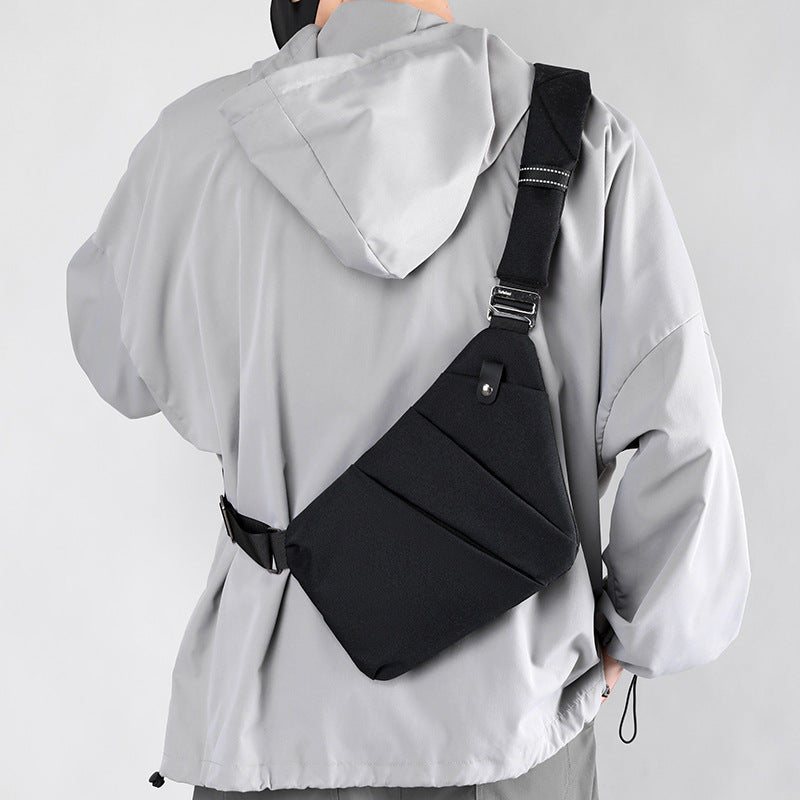"Sac à bandoulière femme antivol, élégant, en tissu hydrofuge, design ergonomique, poches cachées, sécurité optimale."