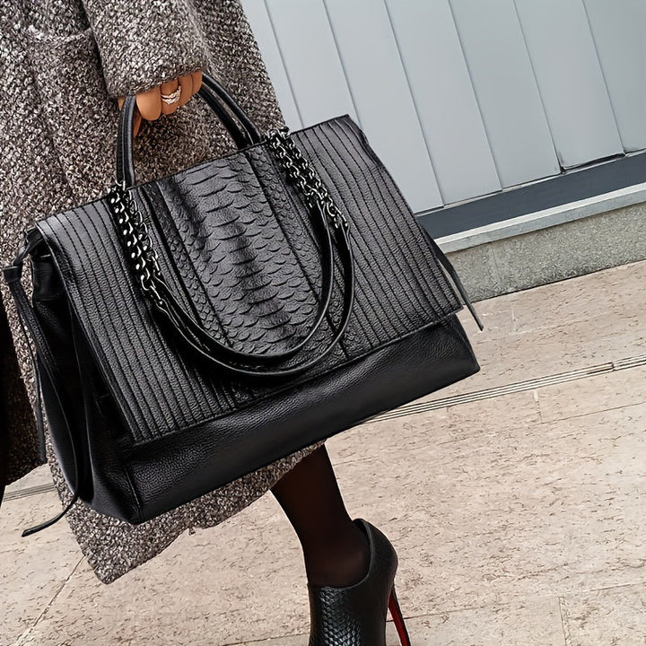 Sac à bandoulière noir élégant pour femmes, grand format avec compartiments, en cuir synthétique, style moderne chic.