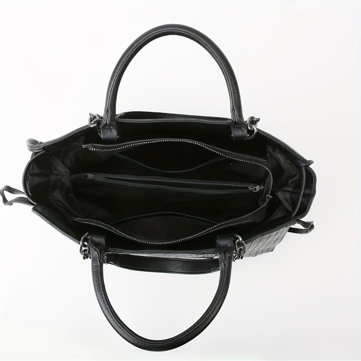 Sac à bandoulière noir élégant pour femmes, grand format avec compartiments, en cuir synthétique, style moderne chic.