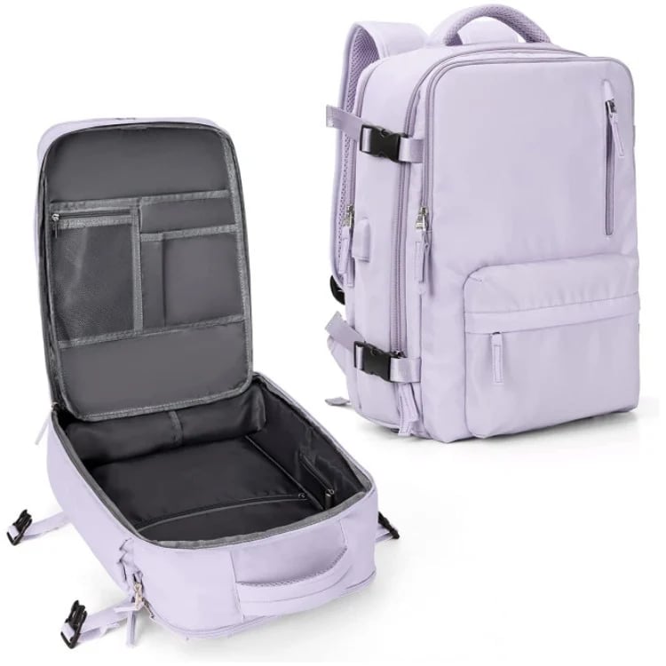 "Sac à dos imperméable bleu marine, grande capacité, avec port USB et design antivol pour voyager et randonnée."