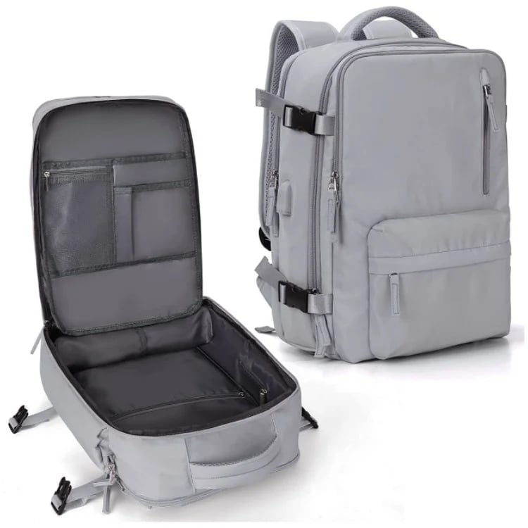 "Sac à dos imperméable bleu marine, grande capacité, avec port USB et design antivol pour voyager et randonnée."