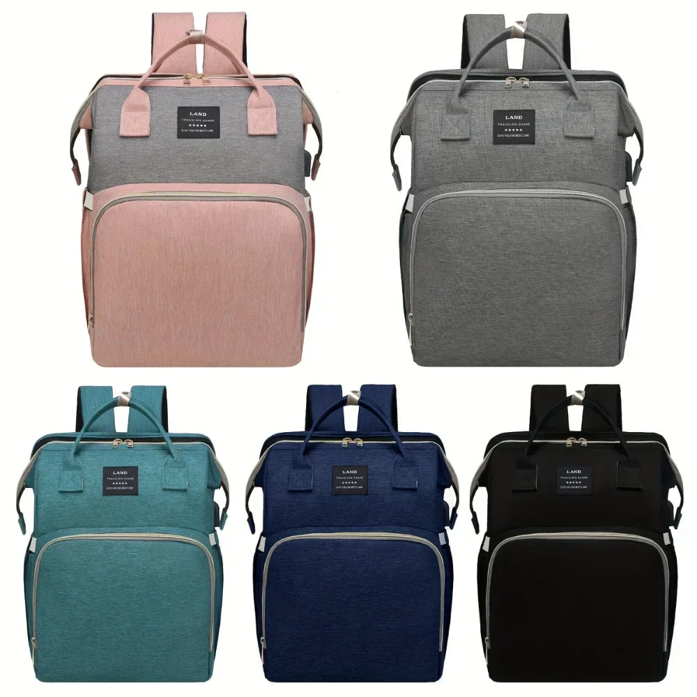 "Sac à langer 3 en 1 élégant et ergonomique avec lit intégré, bretelles ajustables, et compartiments multiples, coloris gris.