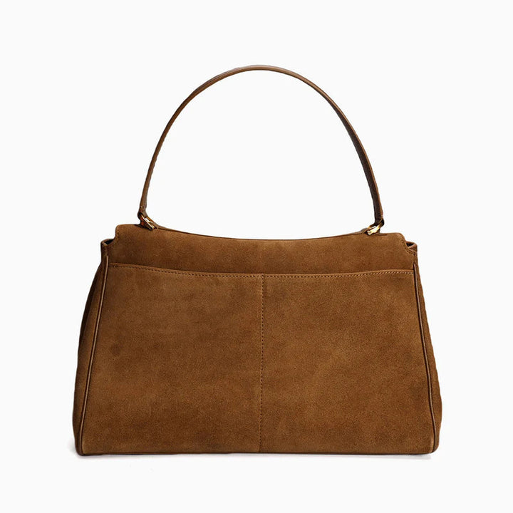 "Sac à main AMÉLIE en daim véritable, automne-hiver, élégant avec fermeture dorée et bandoulière réglable."