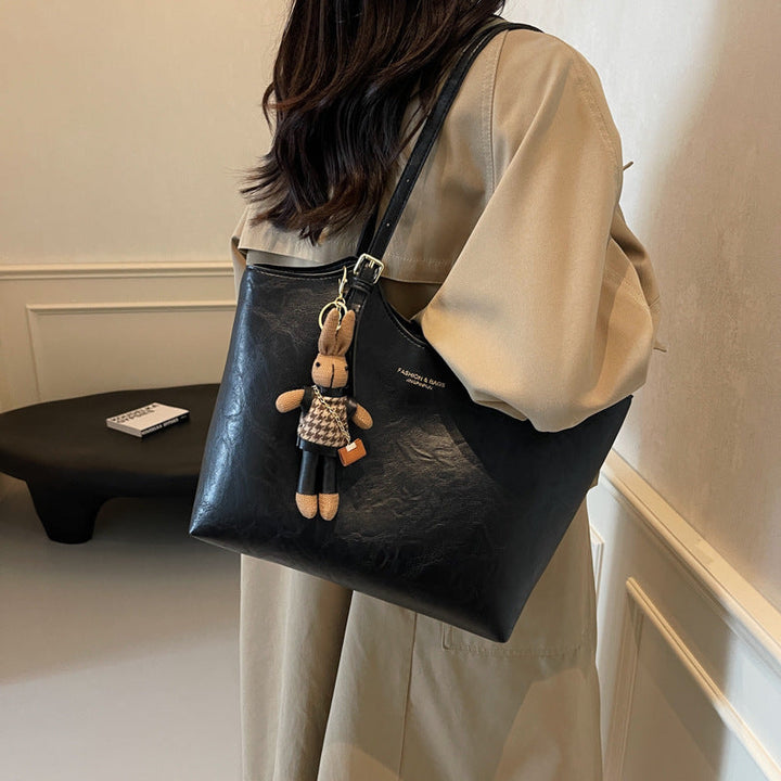 "Sac à main cuir végan Éléna, élégant et moderne, avec design épuré et intérieur spacieux pour femme."