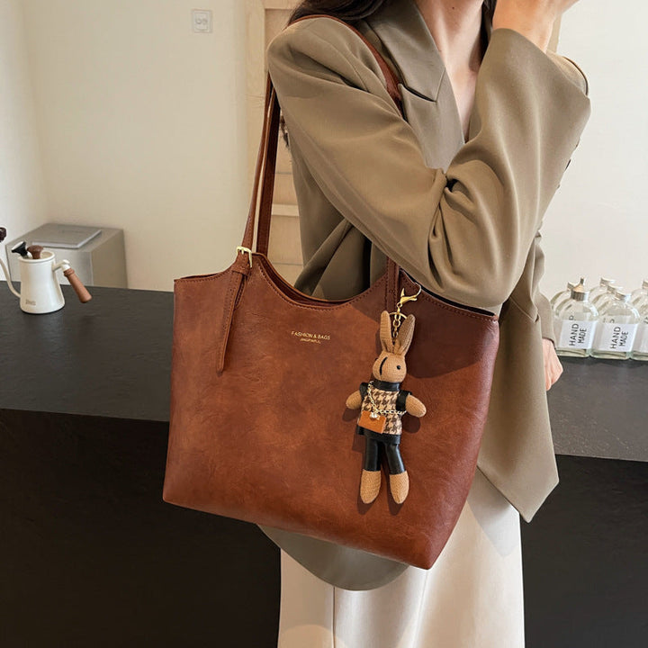"Sac à main cuir végan Éléna, élégant et moderne, avec design épuré et intérieur spacieux pour femme."