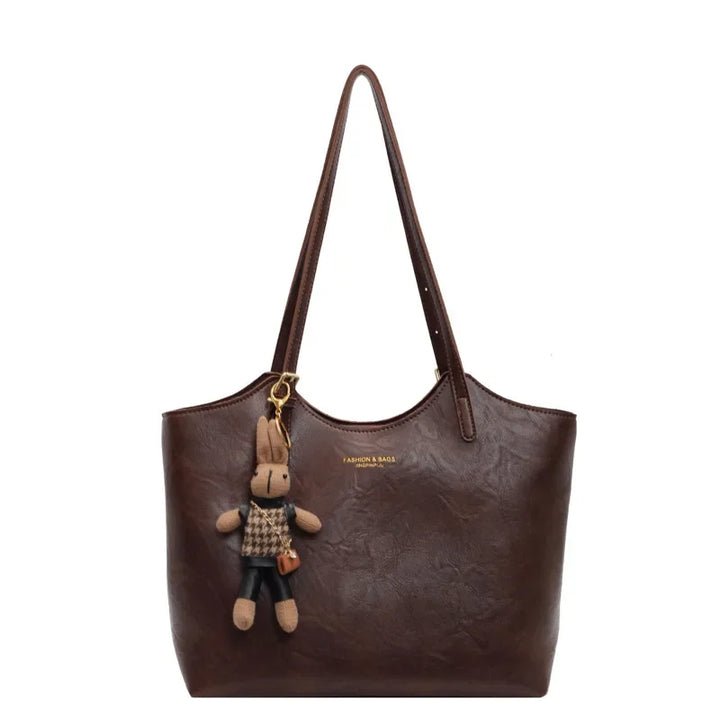"Sac à main cuir végan Éléna, élégant et moderne, avec design épuré et intérieur spacieux pour femme."
