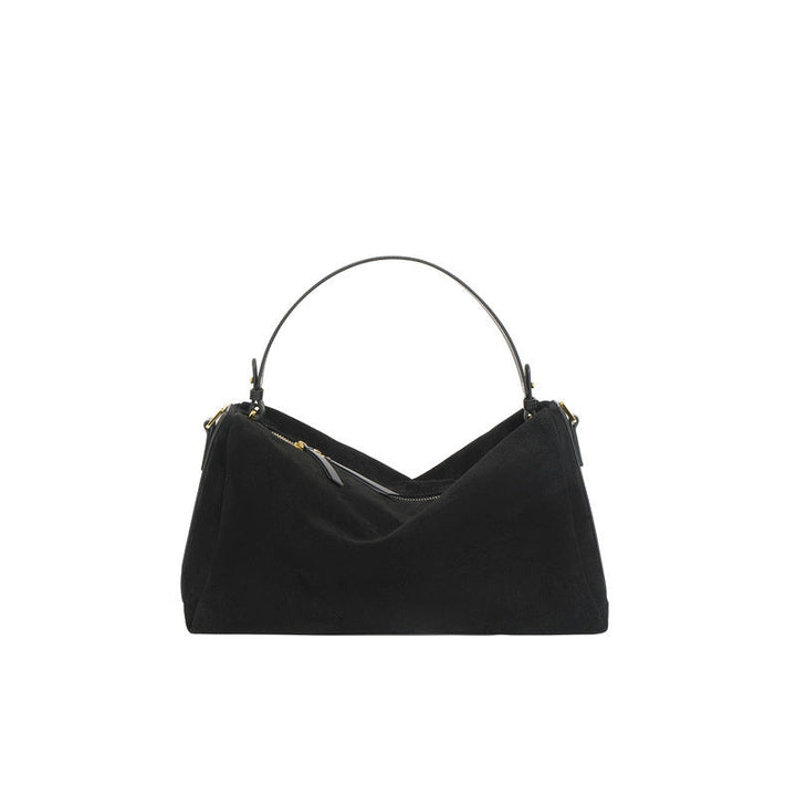 Sac à main élégant en cuir de vachette bicouche, couleur brune, avec anses renforcées et doublure en polyester.