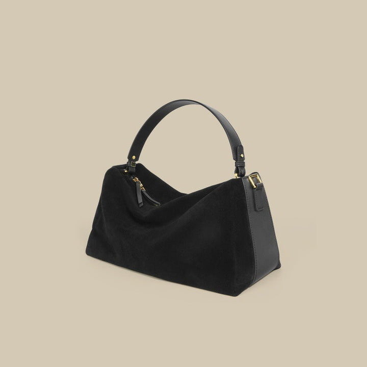Sac à main élégant en cuir de vachette bicouche, couleur brune, avec anses renforcées et doublure en polyester.