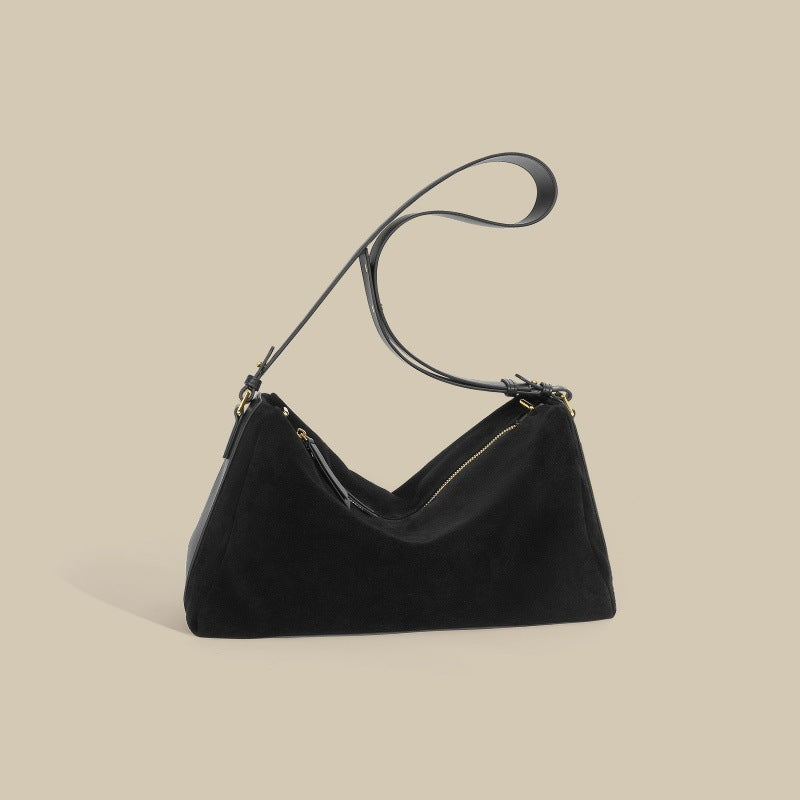Sac à main élégant en cuir de vachette bicouche, couleur brune, avec anses renforcées et doublure en polyester.