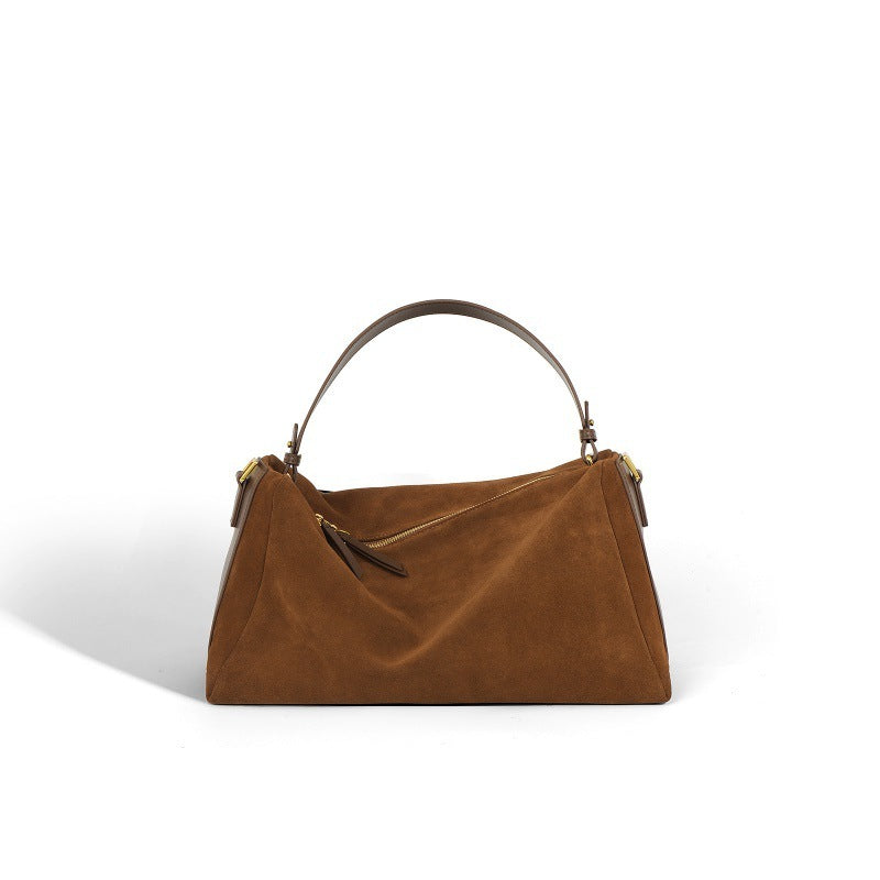 Sac à main élégant en cuir de vachette bicouche, couleur brune, avec anses renforcées et doublure en polyester.