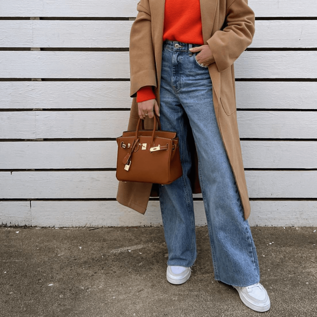 "Sac à main Evelina en cuir luxueux, design élégant avec détails modernes, intérieur spacieux, pour femme tendance."