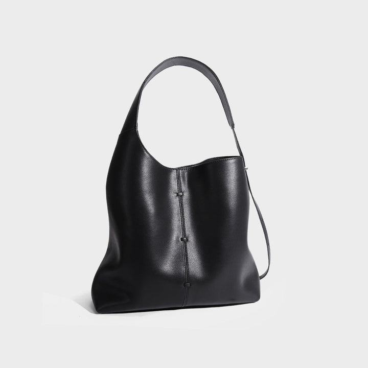 Sac à main femme élégant en cuir bleu foncé, minimaliste et urbain, dimensions 35x26x12 cm avec bandoulière ajustable.