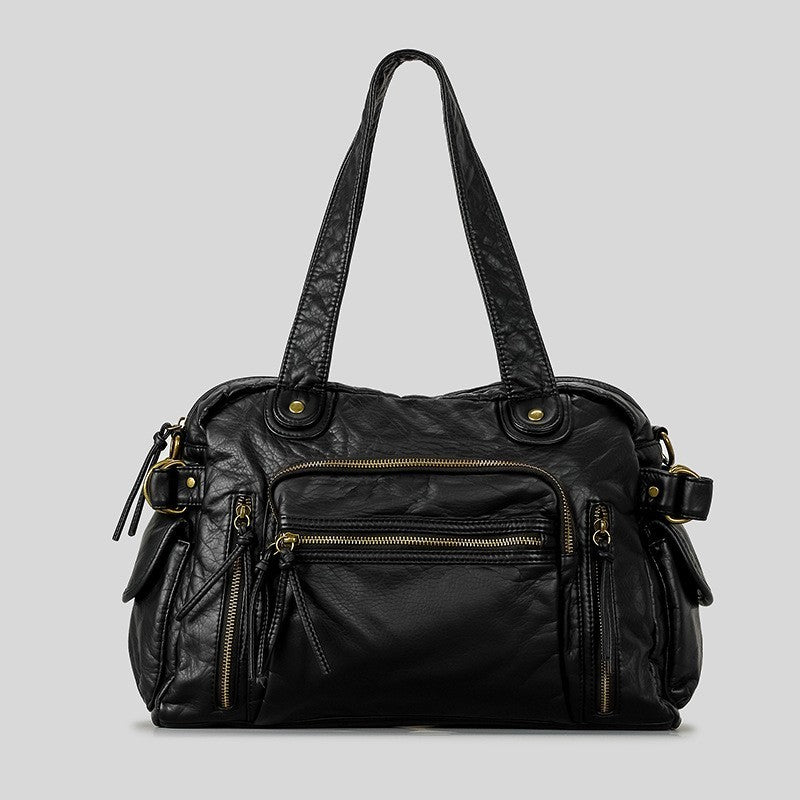 Sac à main rétro en cuir végétalien texturé, avec finitions dorées et anses longues, idéal pour un style élégant.