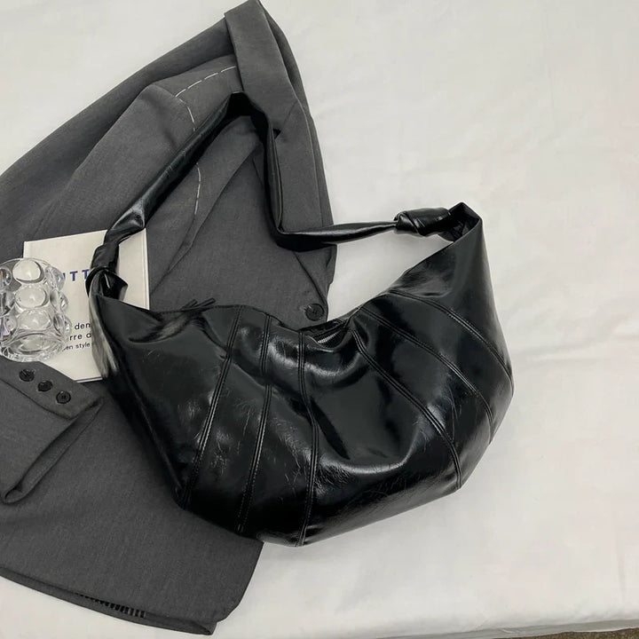 Grand sac banane spacieux pour femme, parfait pour l'organisation quotidienne et la mode.