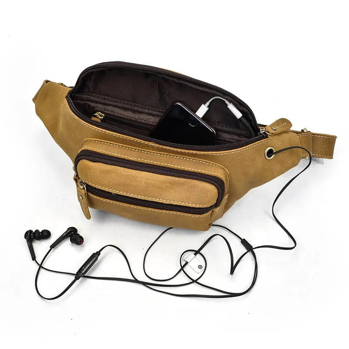 Sac banane homme en cuir véritable marron clair, avec compartiments discrets, pratique pour les essentiels.