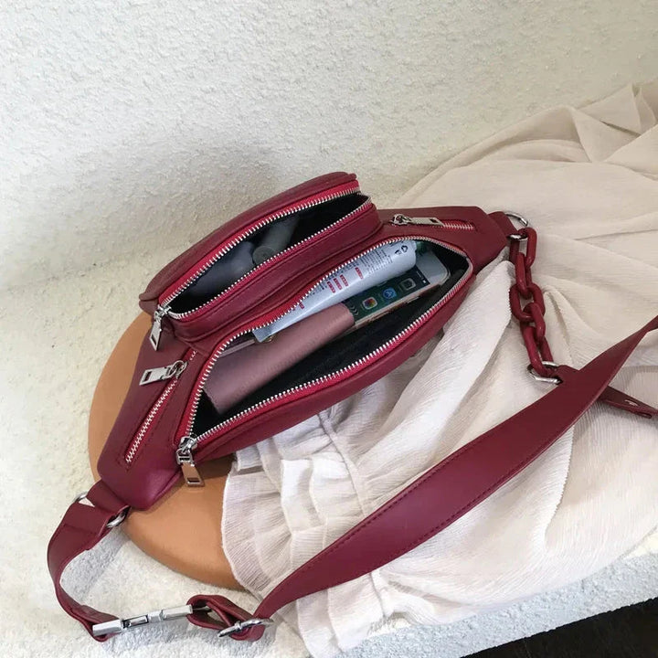 Sac banane rouge pour femme en cuir PU, design moderne et pratique, pour un look tendance et décontracté.