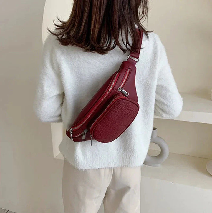 Sac à main banane femme en similicuir rouge vif, parfait pour les loisirs et comme accessoire chic.