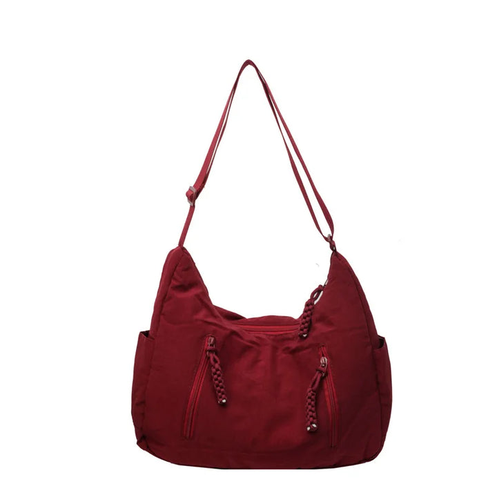 Sac à bandoulière pour femme, conception légère et spacieuse, idéal pour une organisation facile au quotidien.