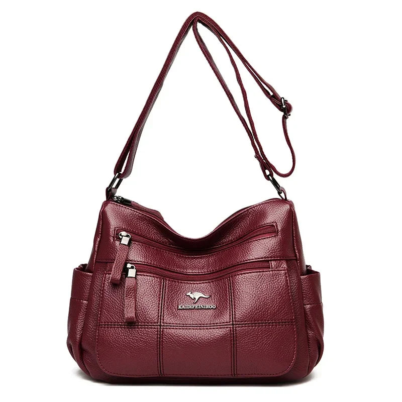 Sac bandoulière femme pratique bordeaux, en similicuir, avec sangle réglable pour un style mode.