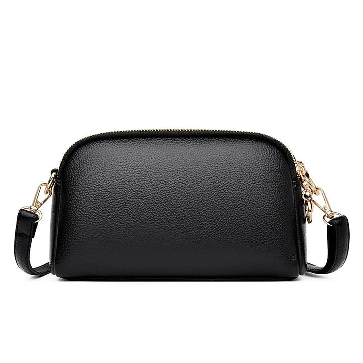 Sac bandoulière minimaliste noir pour femmes, style épuré et tendance