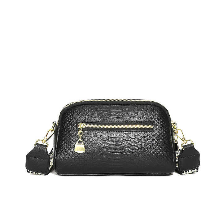 Sac à bandoulière femme effet croco rose poudré, apportant une note de féminité et de tendance.