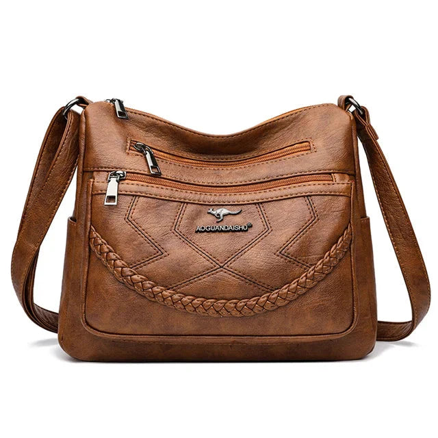 Sac à main femme en cuir souple, bandoulière réglable pour confort, style chic et polyvalent.