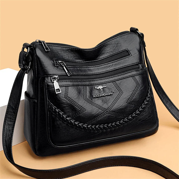 Sac femme en cuir souple, chic et confortable, bandoulière ajustable pour le quotidien.