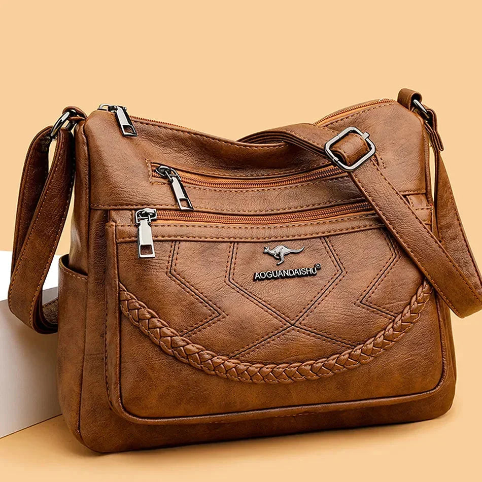 Accessoire de mode femme: sac bandoulière polyvalent en cuir, idéal pour l'organisation.