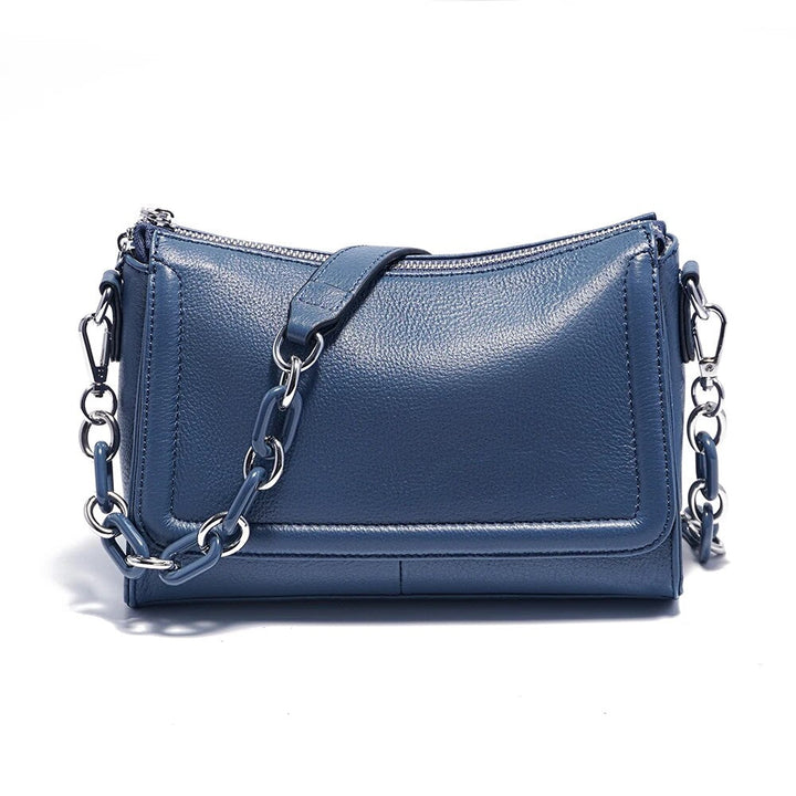 Pochette femme élégante en cuir végétalien, sac bandoulière chic avec bandoulière réglable.