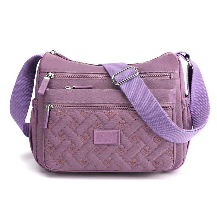 Sac à main femme polyvalent avec compartiments organisateurs. Idéal pour le quotidien, tendance et résistant.