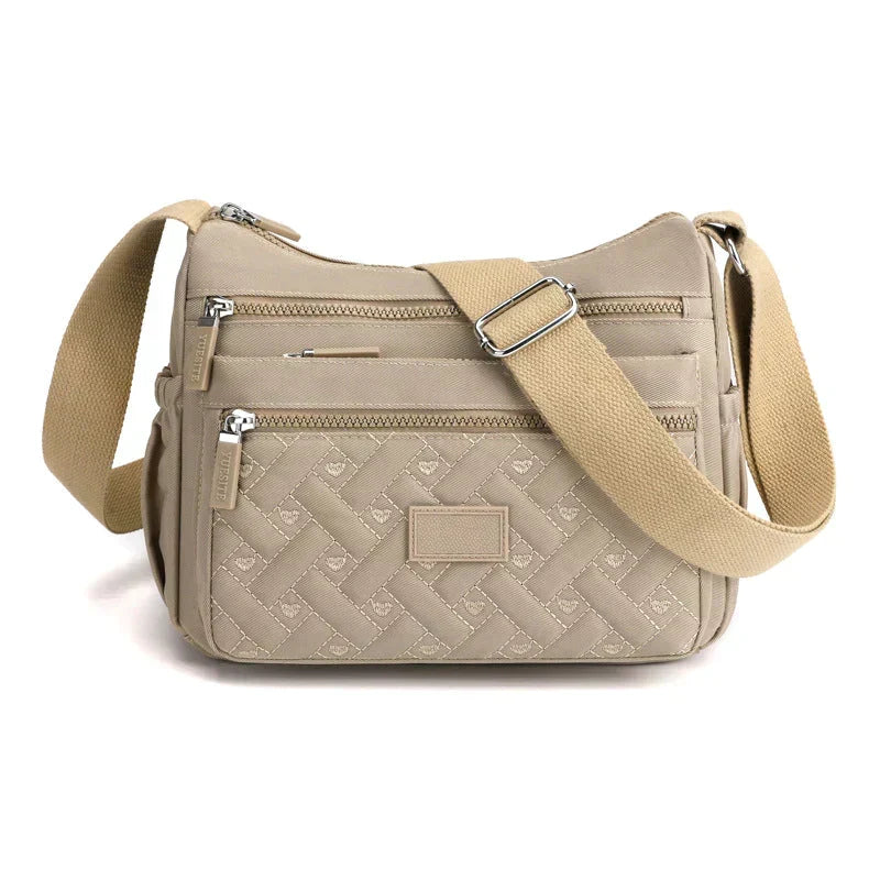 Sac à bandoulière élégant pour femme, parfait pour la ville ou une soirée chic. Accessoire de mode incontournable.