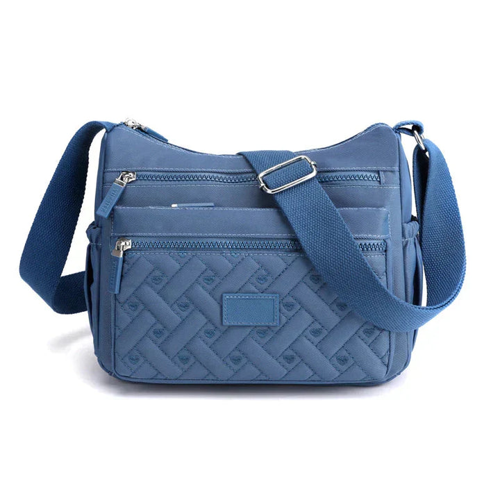 Nouveau sac à bandoulière femme tendance, design moderne. Chic, élégant et très pratique au quotidien.