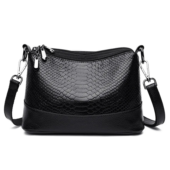 Sac bandoulière femme élégant effet crocodile, en simili cuir noir, chic et pratique.