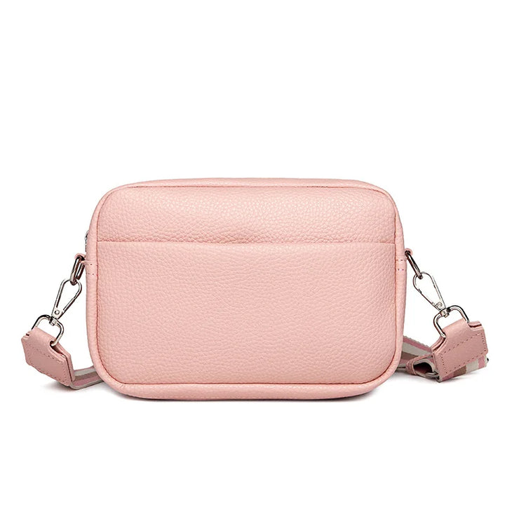Sac bandoulière femme minimaliste en cuir PU, sangle large, un accessoire mode élégant et discret.